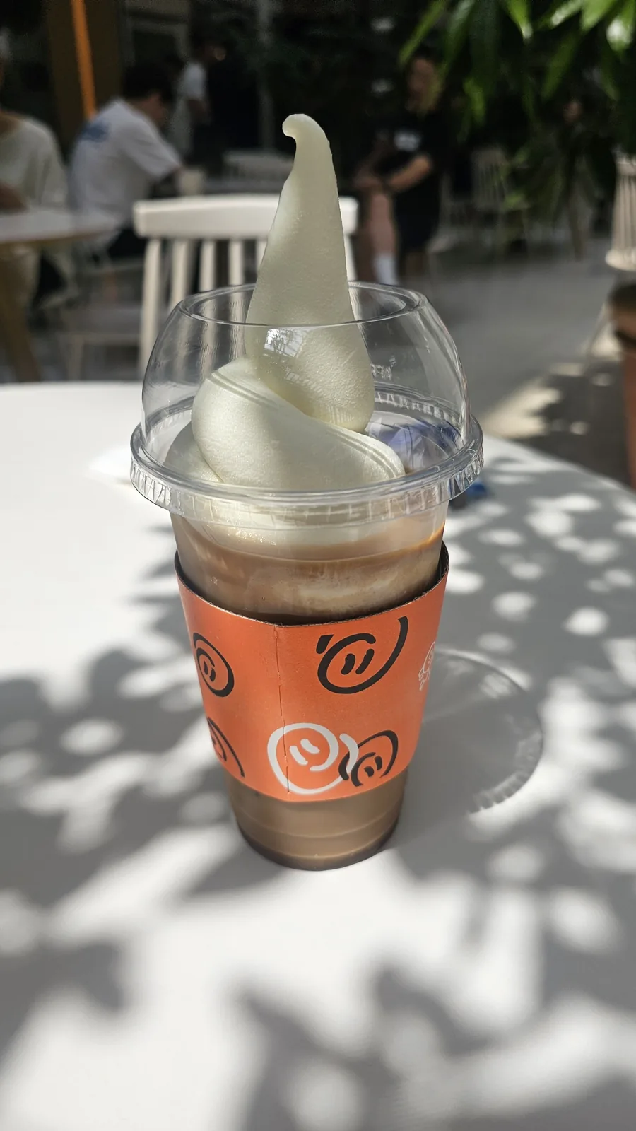 BERG coffee Eibsee layered drink with soft ice cream in orange branded cup sleeve at The Hyundai Seoul