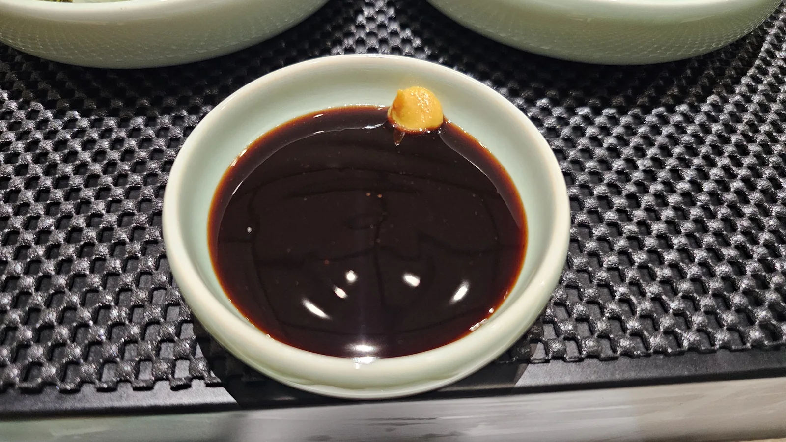 Soy-based dipping sauce with mustard for eel at Daedong Jangeo