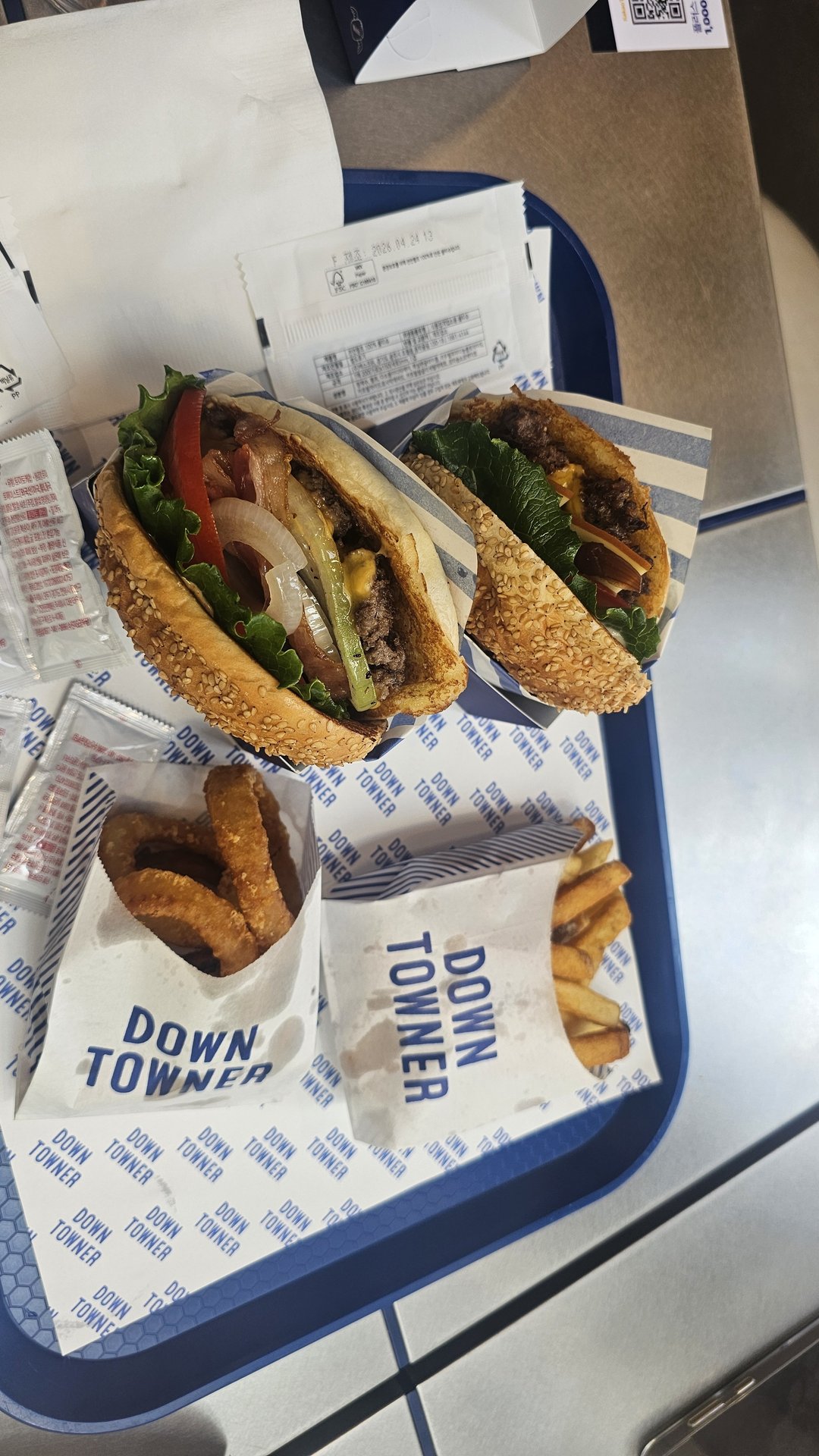 Full tray at Downtowner Yeouido with two burgers, original fries, and onion rings