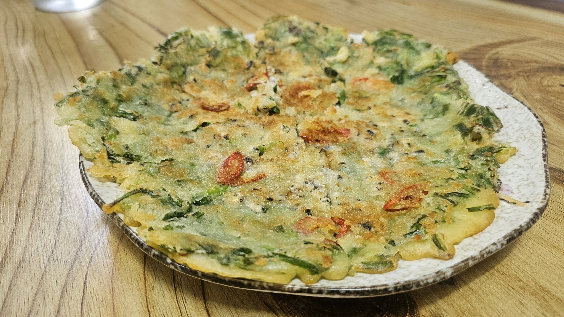 Jaecheop jeon freshwater clam pancake at Gareung Sikdang with crispy golden edges