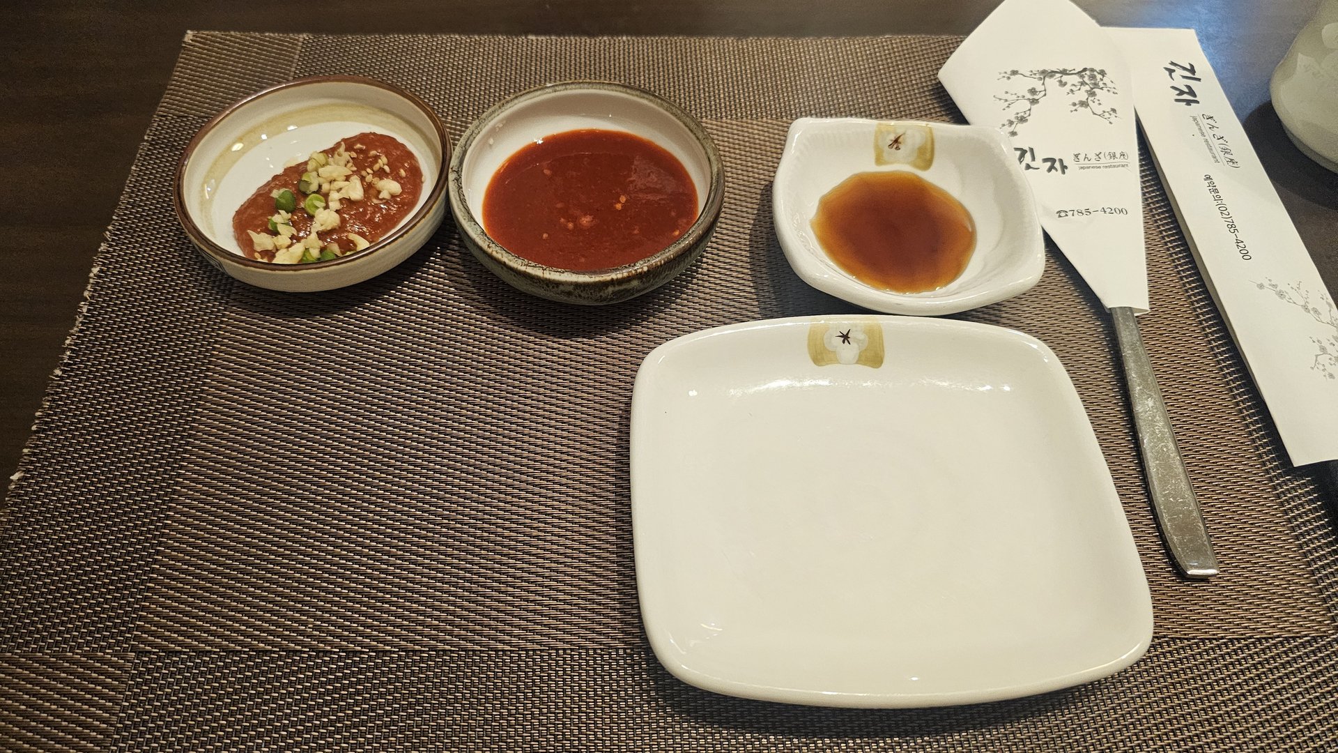 Three dipping sauces at Ginza Yeouido including soy vinegar, ponzu, and spicy sauce