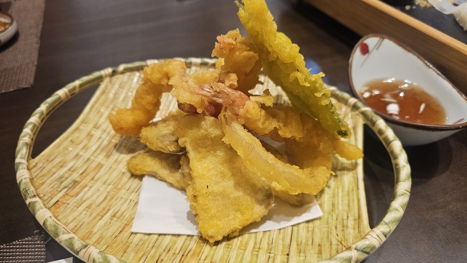Tempura assortment of shrimp, fish, and vegetables in bamboo basket with tentsuyu dipping sauce at Ginza Yeouido