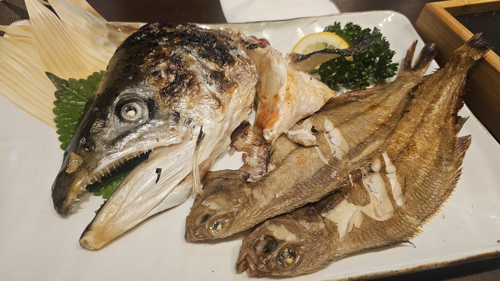 Grilled fish course with large whole fish head and small grilled fish at Ginza Yeouido