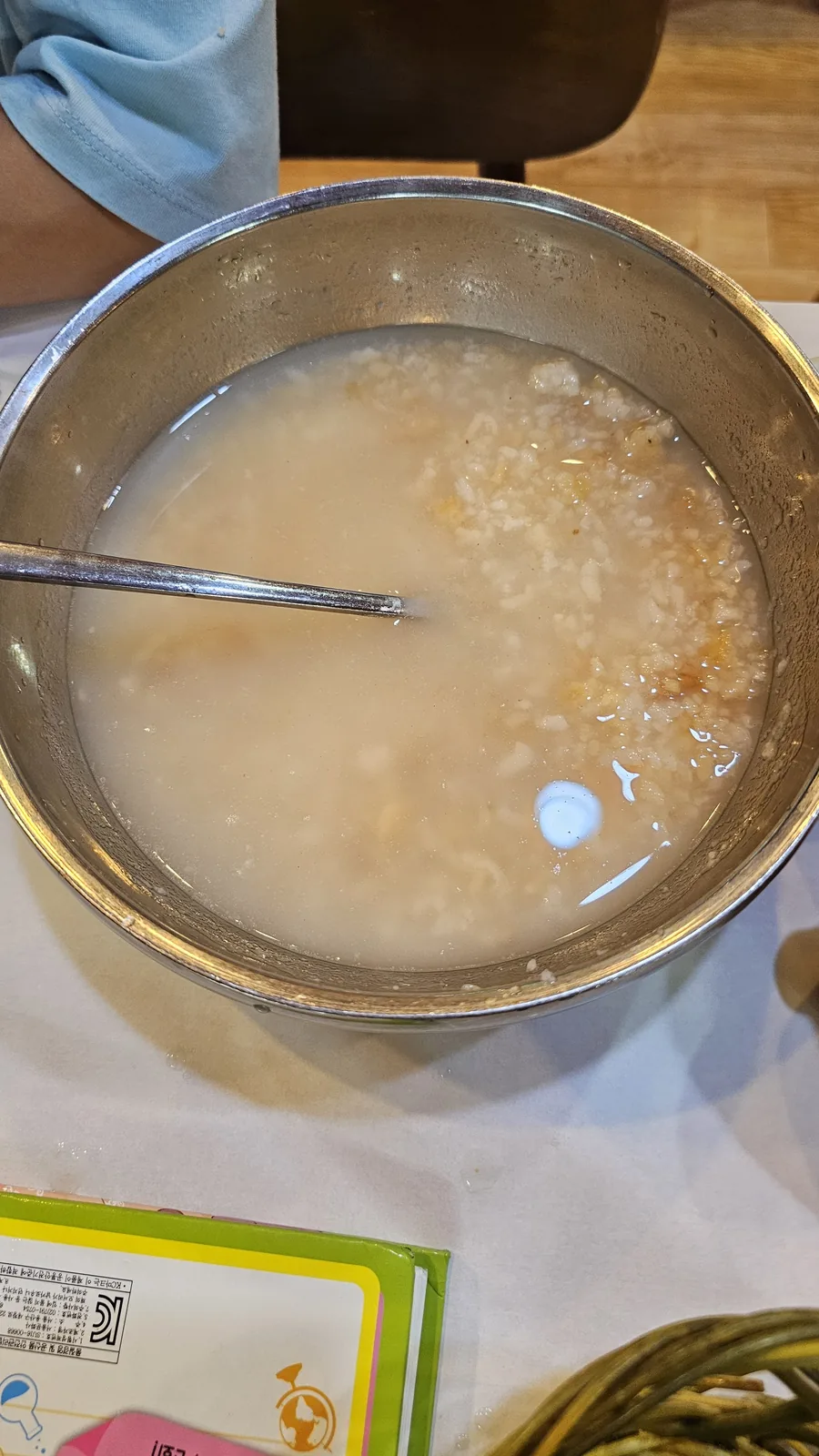 Nurungji tang scorched rice soup in stainless steel bowl at Haeoeum