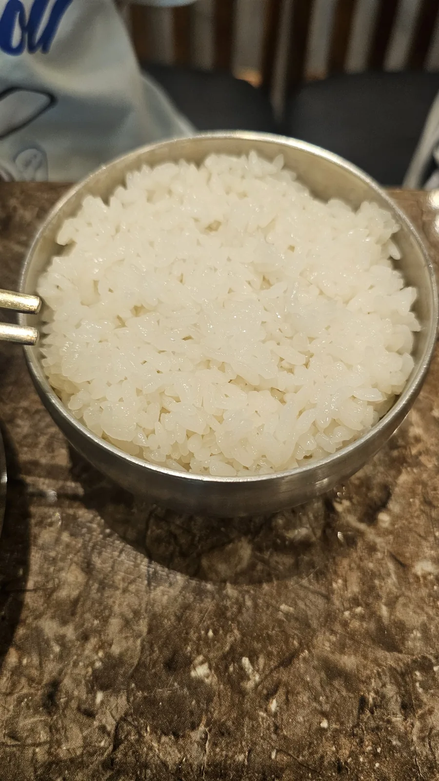 Stainless steel bowl of steamed white rice (kongibap) served at Jogane Galbi Mokdong