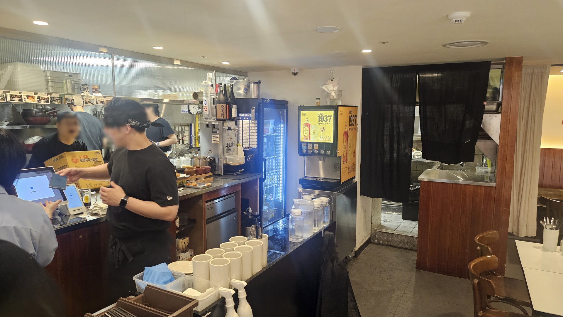 Open kitchen counter at Keebo Rock and Roll with Asahi beer tap and 1937 drink machine