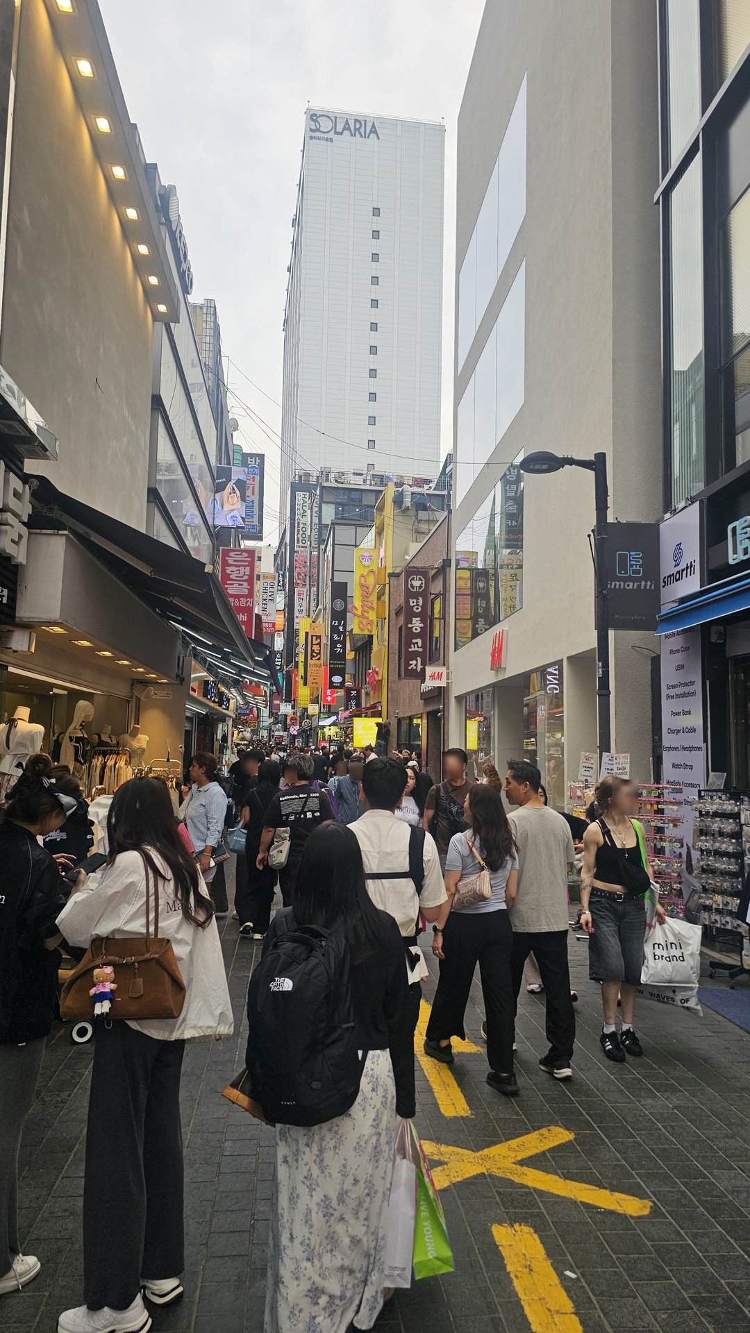 Myeongdong main street packed with tourists and shoppers Seoul