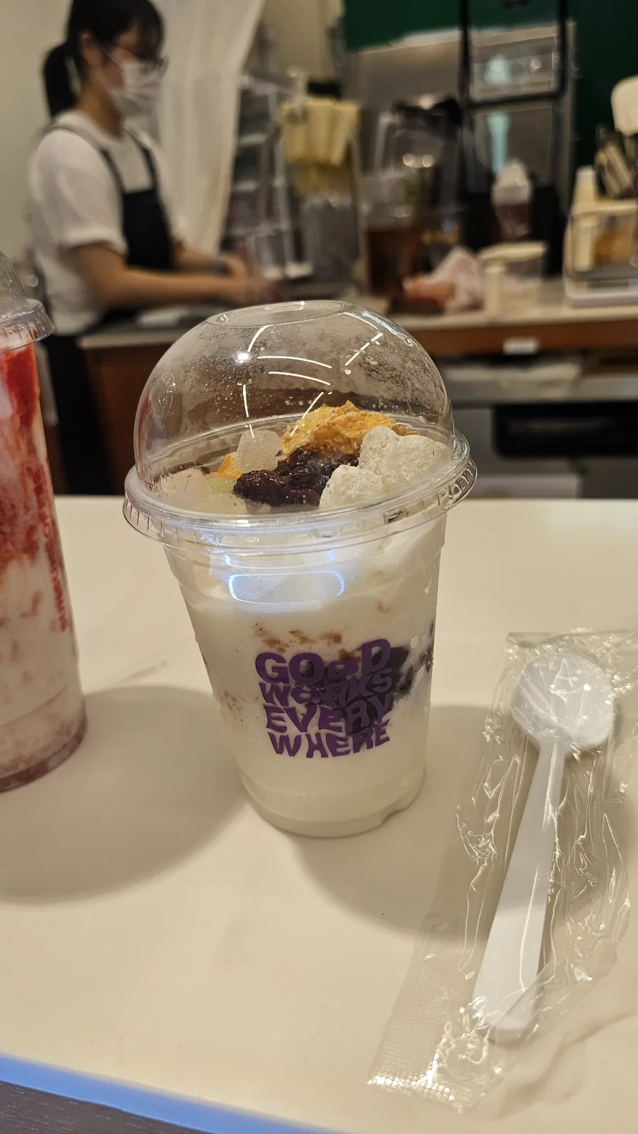Strawberry yogurt frebe at Sunsun Coffee Yeouido in branded cup with distinct pink strawberry and white yogurt layers