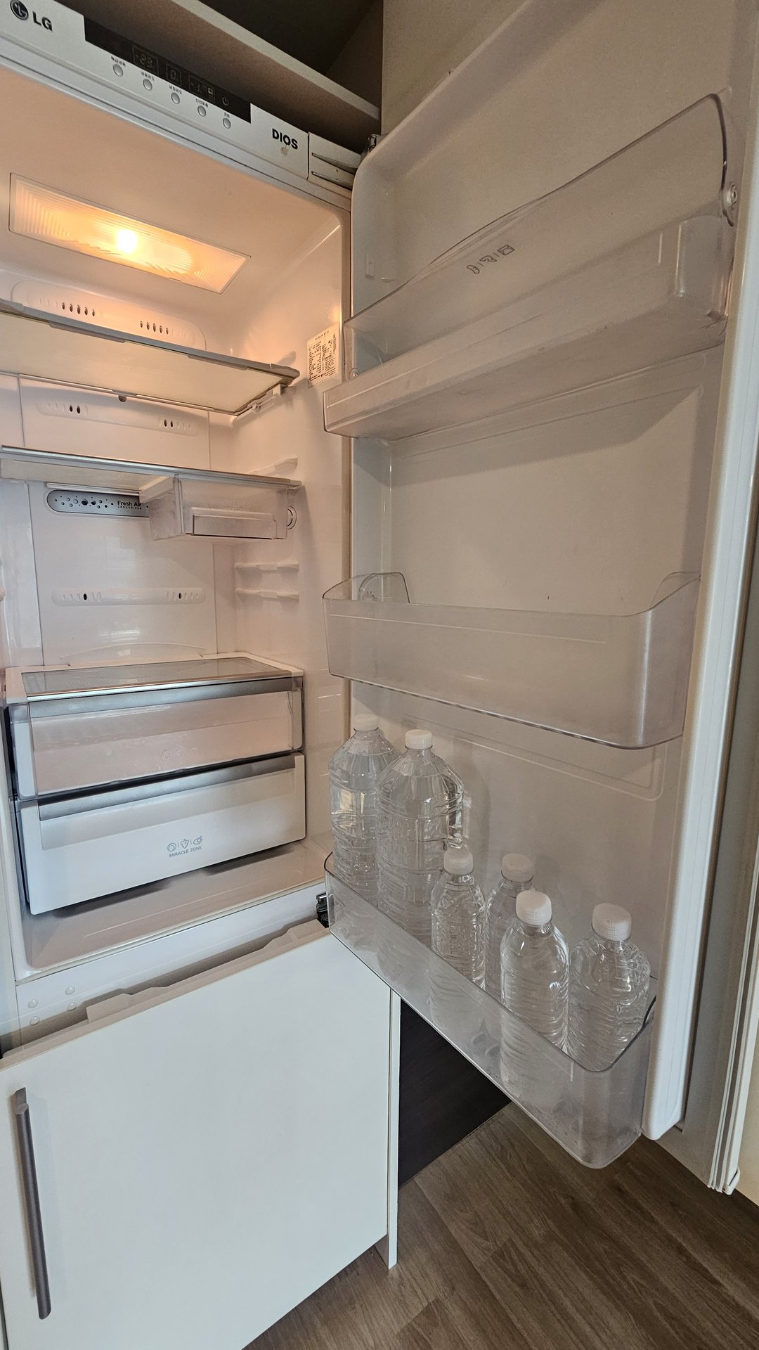 LG refrigerator interior stocked with bottled water at Vivace Resort Hadong