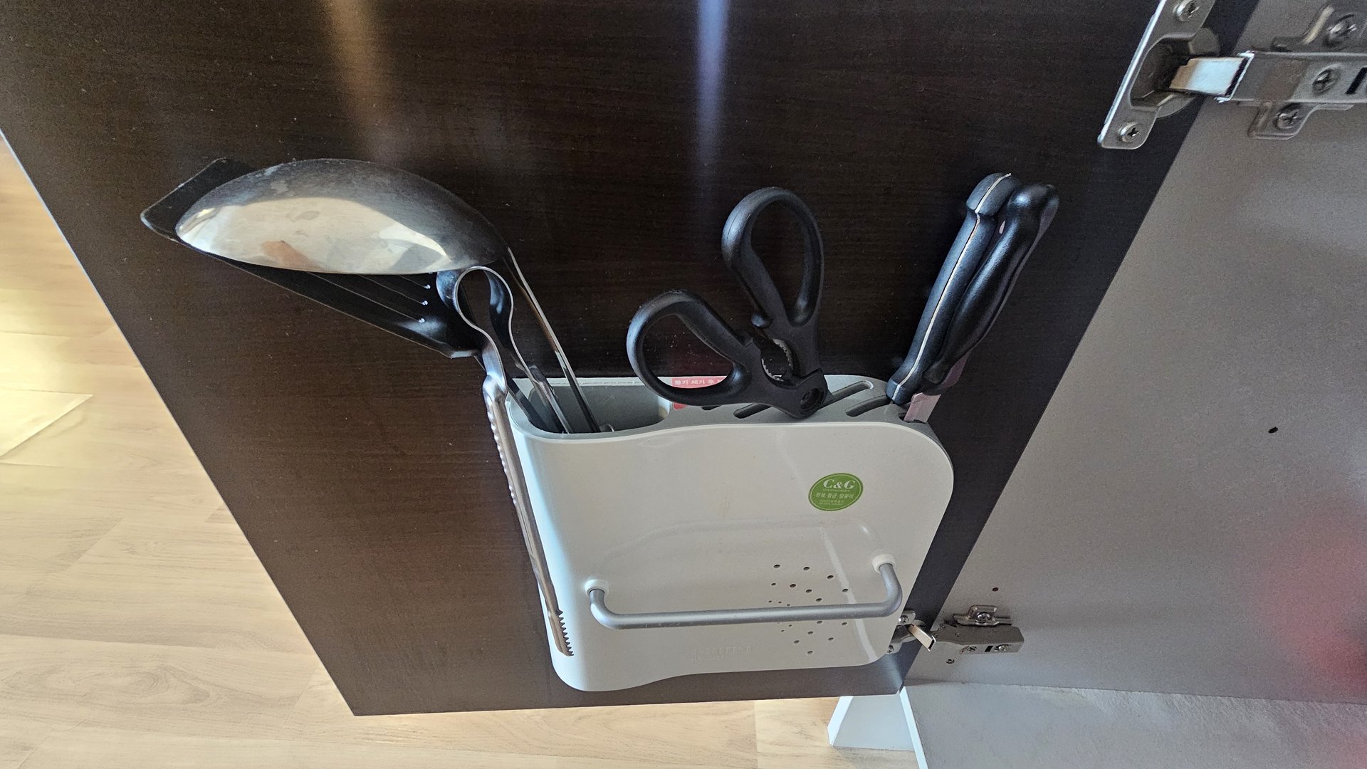 Kitchen drawer with scissors, ladle, spatula and cutting board at Vivace Resort