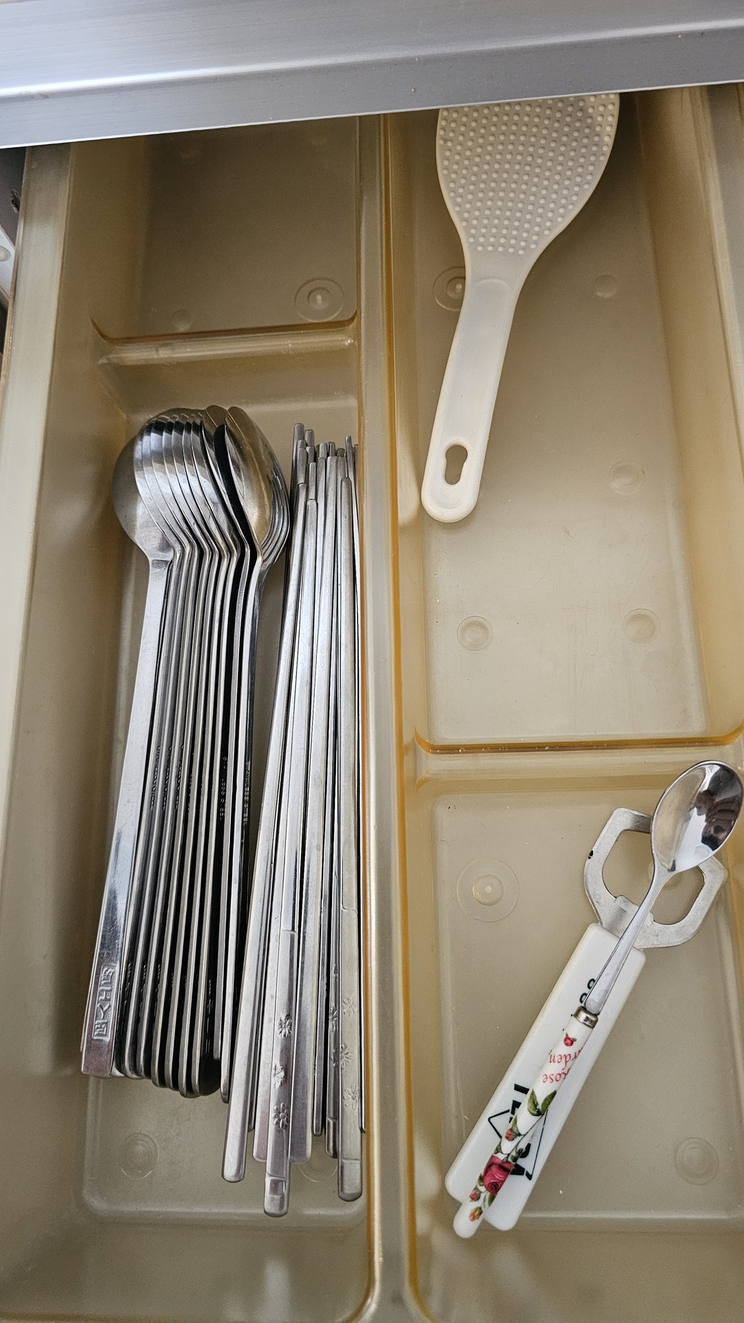 Cutlery drawer with stainless steel chopsticks, spoons, rice paddle at Vivace Resort