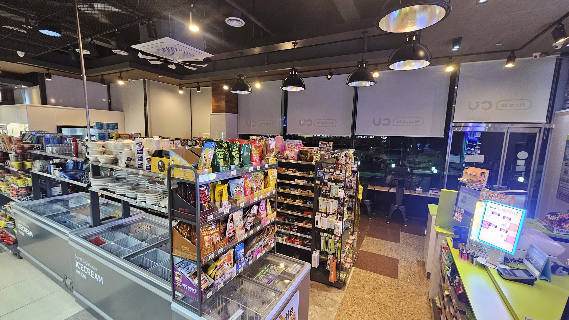 Convenience store inside Vivace Resort Hadong with ice cream freezer and snack shelves in the evening
