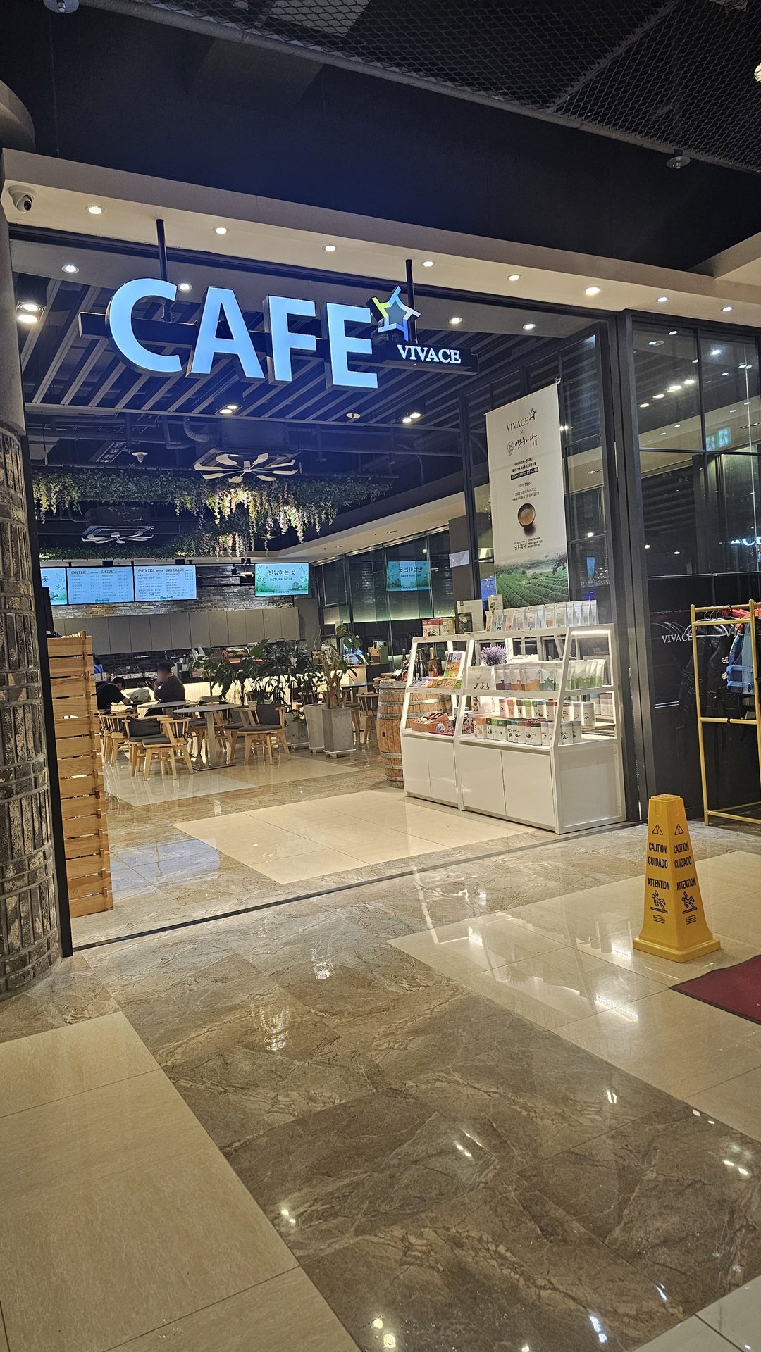 VIVACE Cafe sign at Vivace Resort Hadong in the evening with interior seating visible through glass