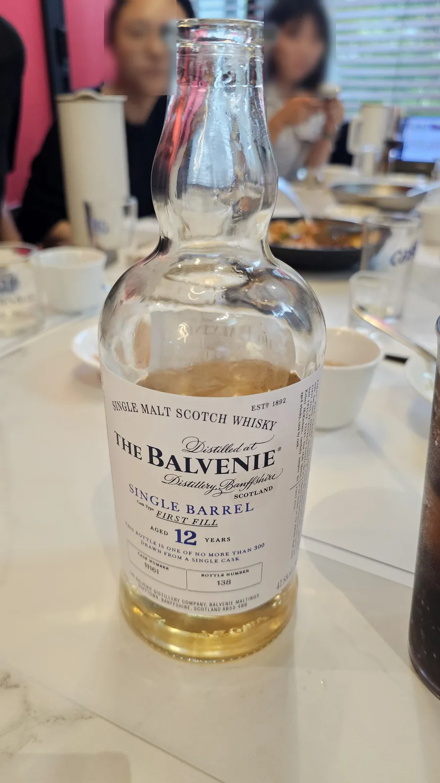 The Balvenie 12 Year Single Barrel whiskey bottle nearly empty on table at Xin Hong Lou Yeouido