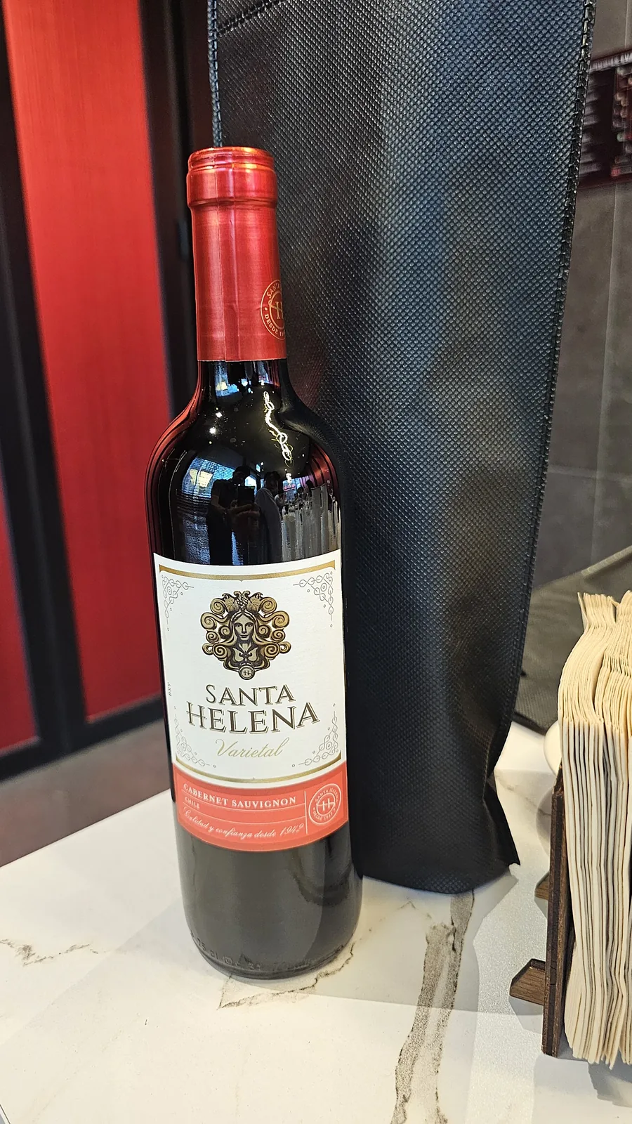 Santa Helena Cabernet Sauvignon bottle with red foil capsule close-up at Xin Hong Lou
