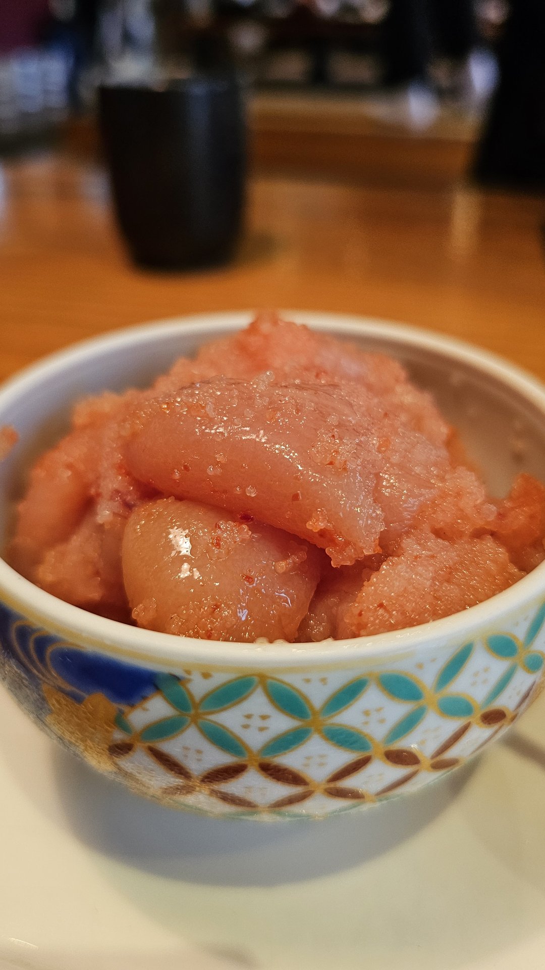 Close-up of Yamaya mentaiko — pink spicy pollock roe in a small dish